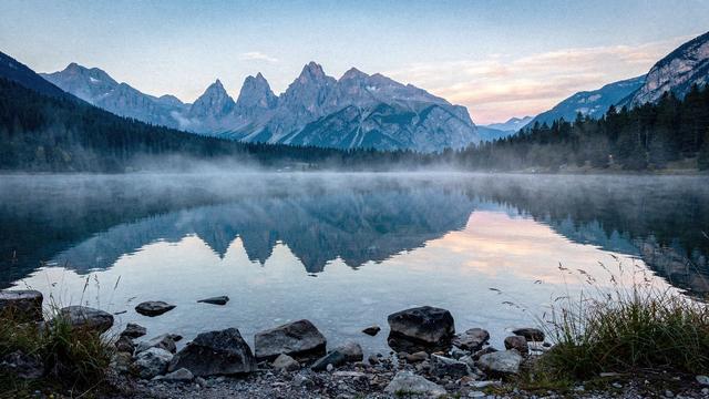 Alpine lake with reflections of the Dolomites in the early morning